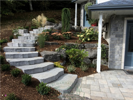 Archambault Paysage, conception d'aménagement paysager et jardin d'eau, pose et nettoyage de pavé-uni, gazon naturel et synthétique.